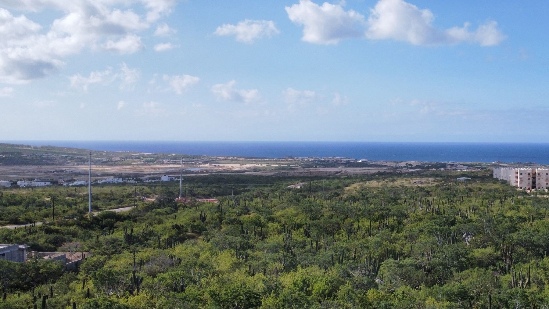 Vista aérea real desde el terreno de Oriente Residencial hacia el Océano Pacífico